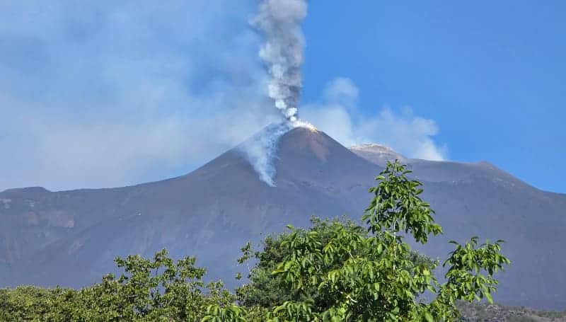 Mount Etna with smoke rising from the summit crater