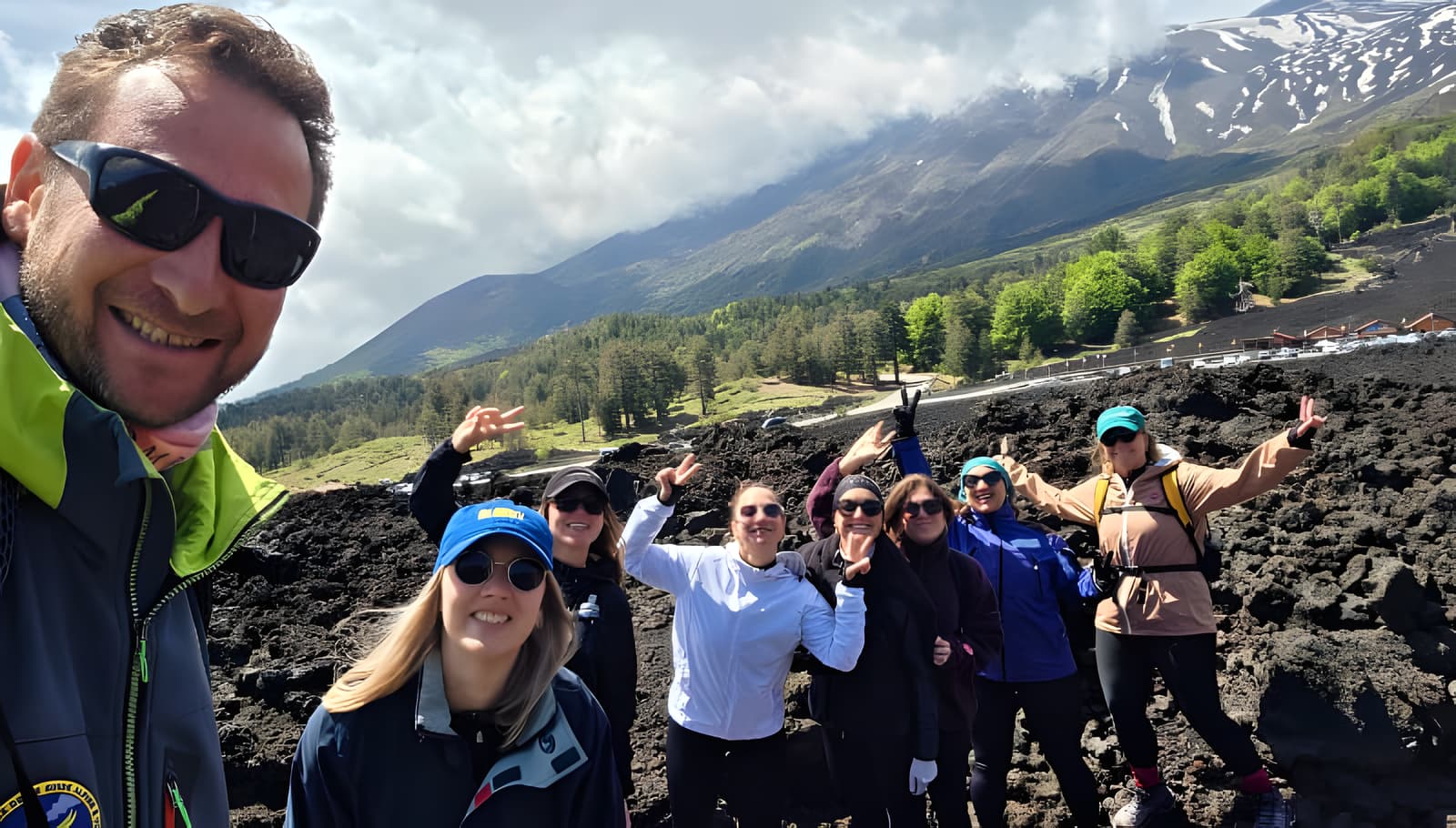 Hikers on Mount Etna's north side lava fields