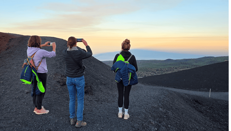 Sunset hike on Mount Etna with panoramic landscape