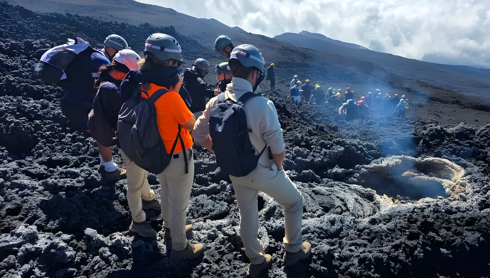 Guided group exploring fumaroles on the Etna 3000 hike
